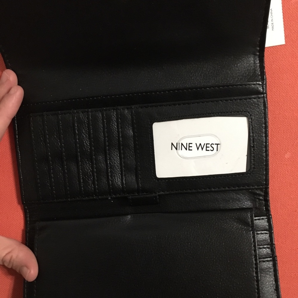 Black Nine West wallet with silver buckle